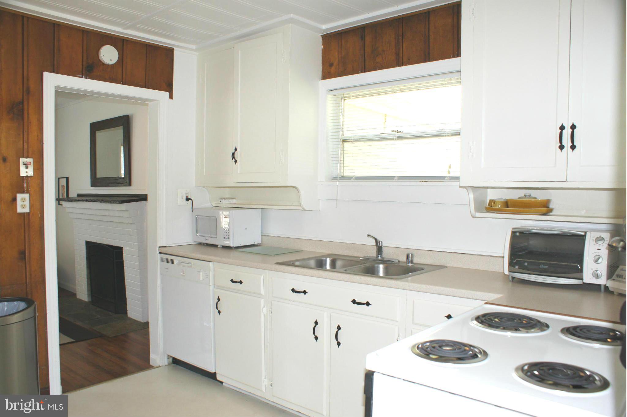 1822 Potomac Road Edgewater, MD 21037 - Photo 14 of 30 a kitchen with a sink stove and cabinets
