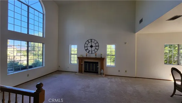 a view of hall way with furniture