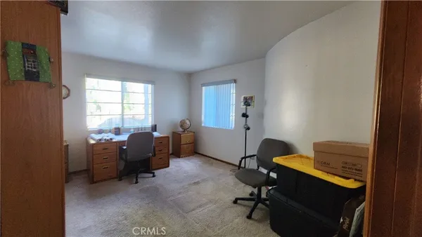 a view of hall way with furniture