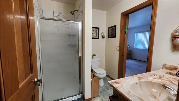 a bedroom with a bed and a closet