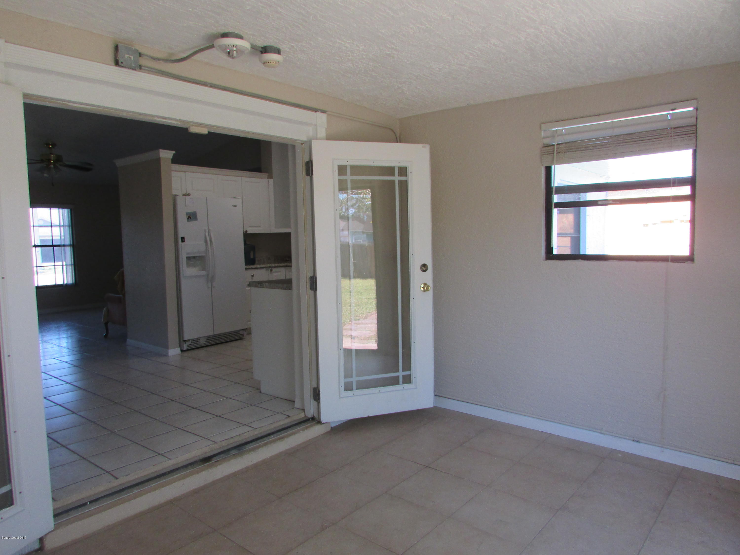 571 Degroodt Road Southwest Palm Bay, FL 32908 - Photo 6 of 12 ENCLOSED PORCH/OFFICE