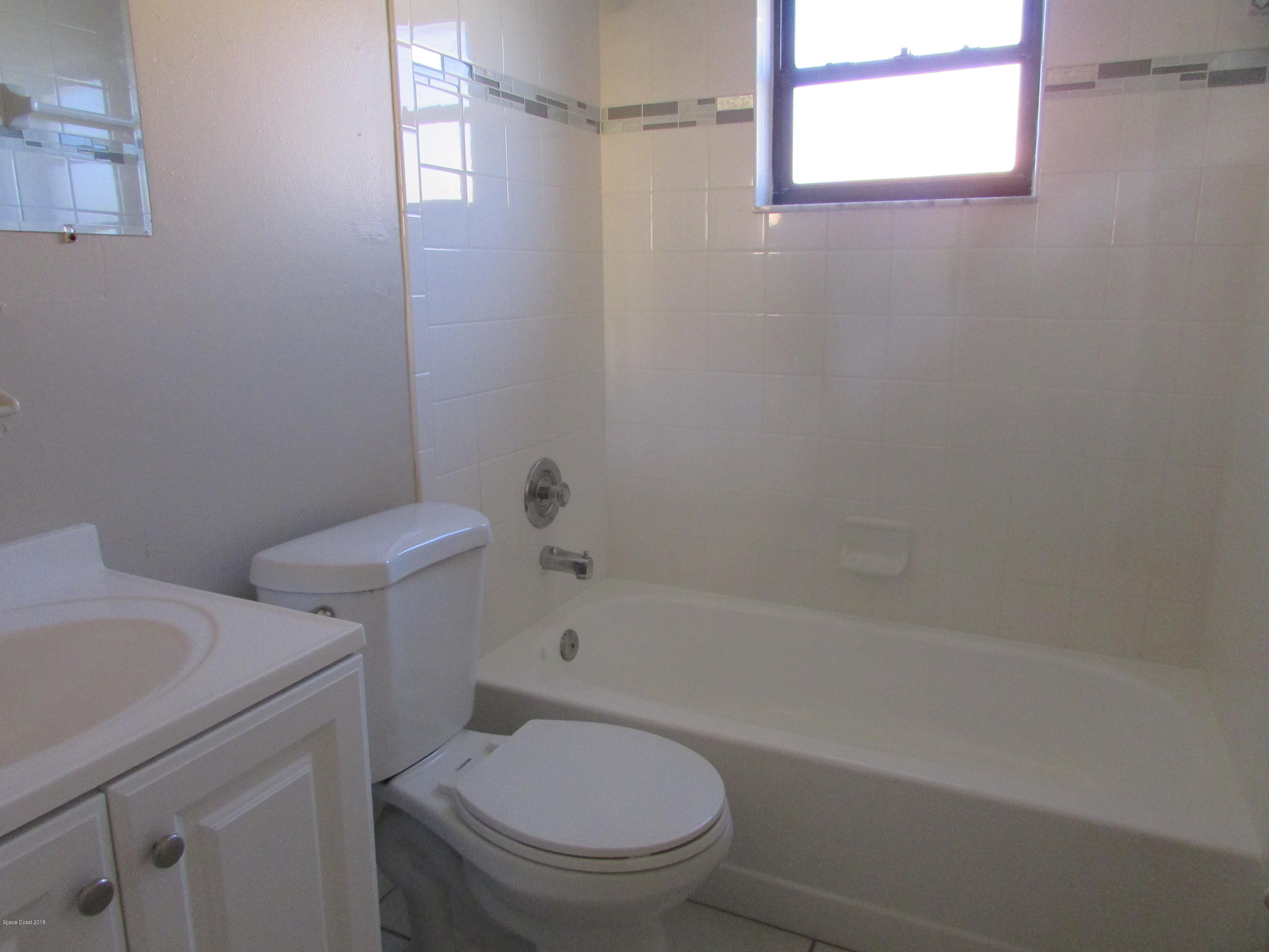 571 Degroodt Road Southwest Palm Bay, FL 32908 - Photo 9 of 12 REMODELED BATHROOM