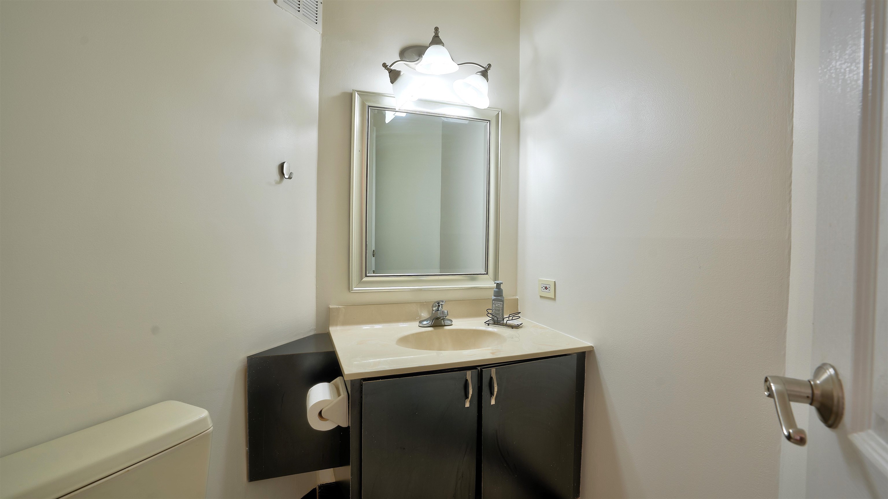 720 Harmon Cove Tower, Unit 720 Secaucus, NJ 07094 - Photo 17 of 49 a bathroom with a sink and a mirror