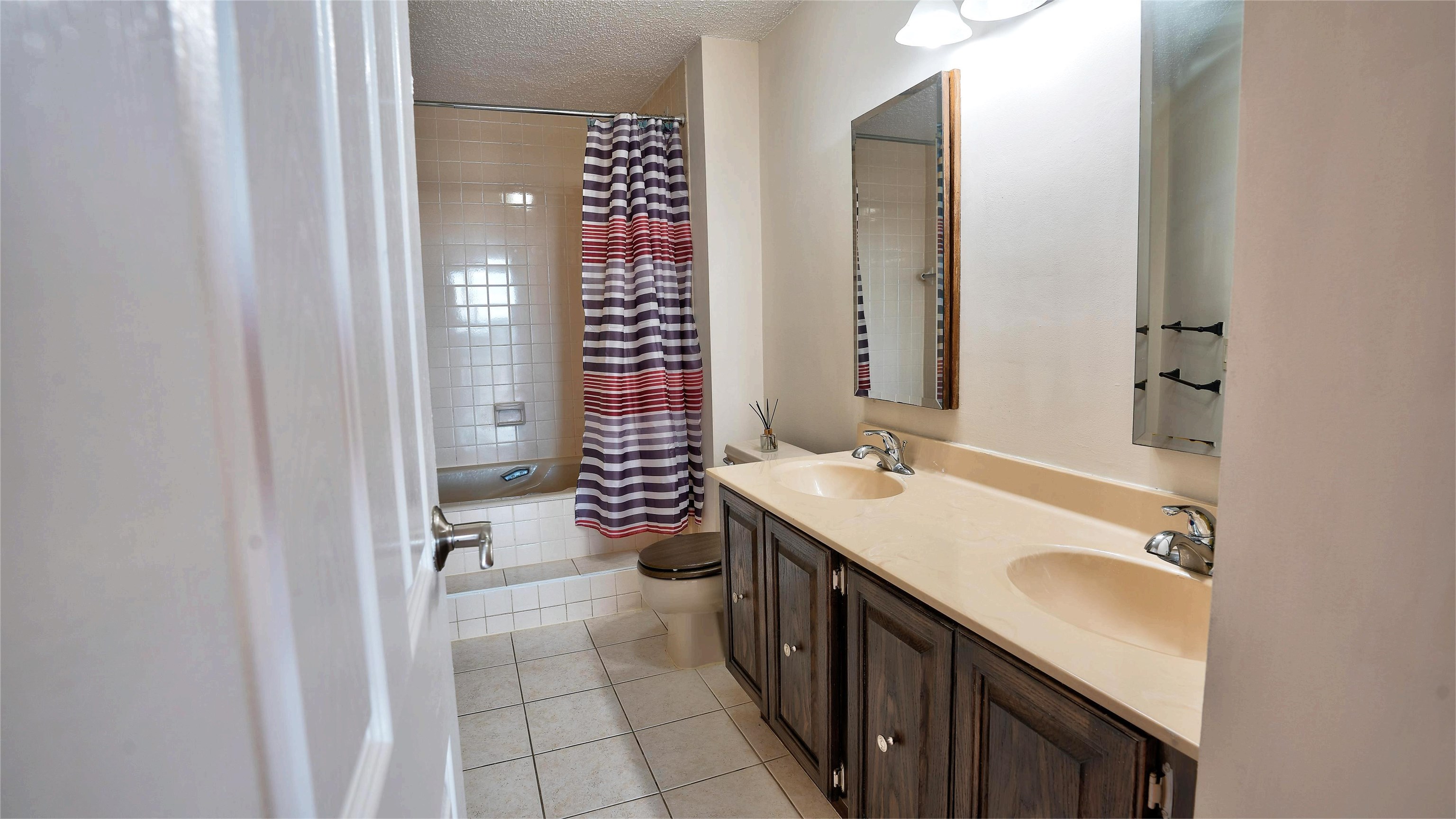 720 Harmon Cove Tower, Unit 720 Secaucus, NJ 07094 - Photo 23 of 49 a bathroom with a sink a toilet and shower