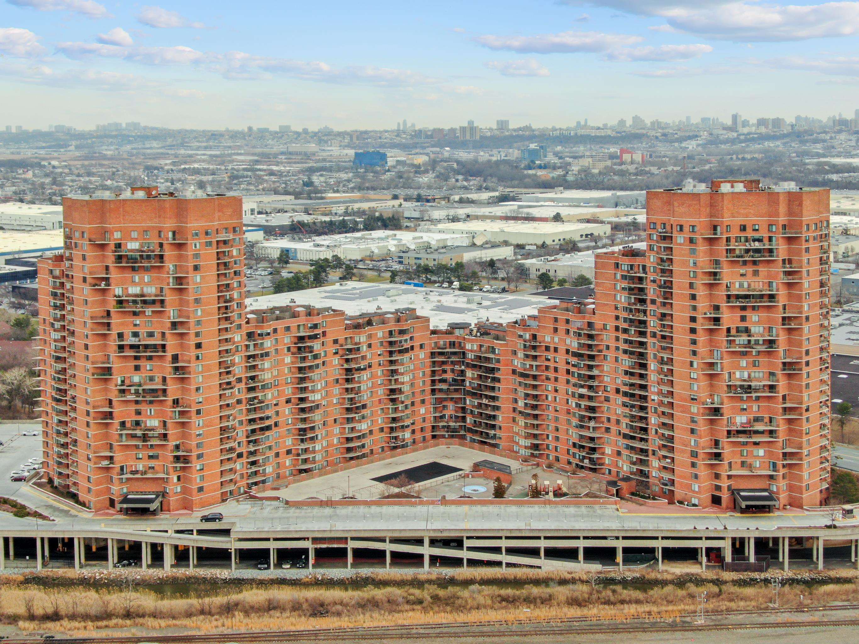 720 Harmon Cove Tower, Unit 720 Secaucus, NJ 07094 - Photo 34 of 49 a view of a large building with a lake view
