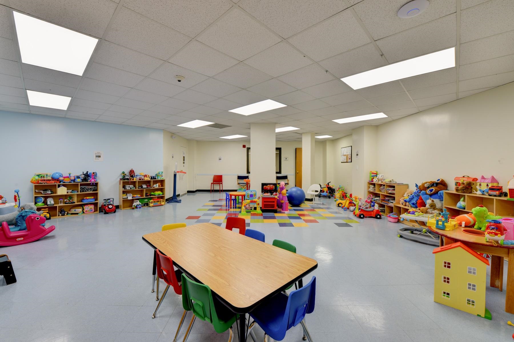 720 Harmon Cove Tower, Unit 720 Secaucus, NJ 07094 - Photo 35 of 49 a group of people sitting in a room