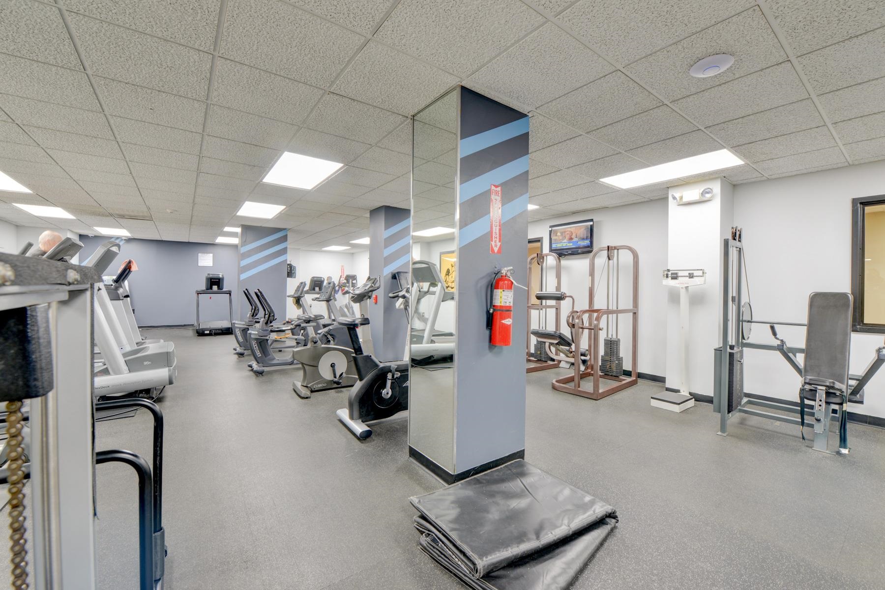 720 Harmon Cove Tower, Unit 720 Secaucus, NJ 07094 - Photo 37 of 49 a view of a room with gym equipment