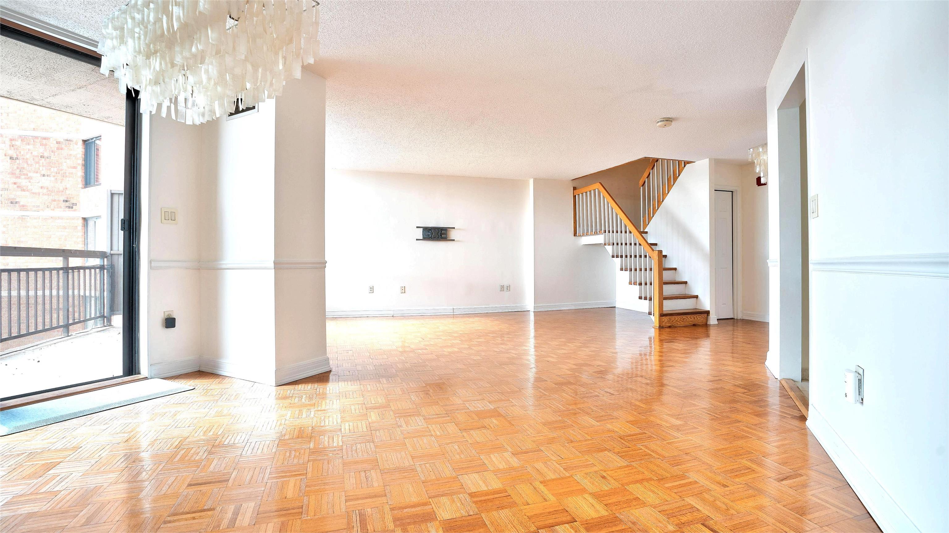 720 Harmon Cove Tower, Unit 720 Secaucus, NJ 07094 - Photo 8 of 49 a view of a hallway view with wooden floor and staircase