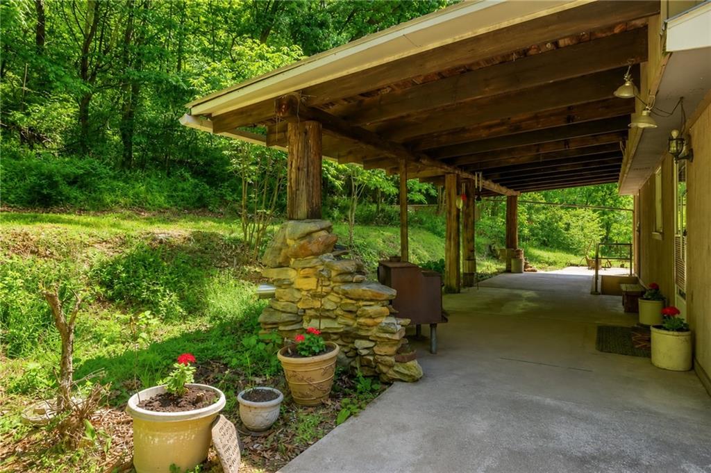 149 Seneca School Road Harmony, PA 16037 - Photo 18 of 50 Huge covered patio with wooded views.