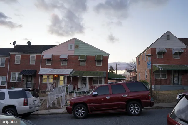a view of a car parked in front of a building