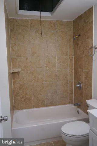 a bathroom with a toilet and shower