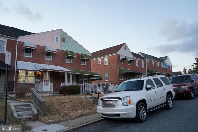 a front view of a house with parking space