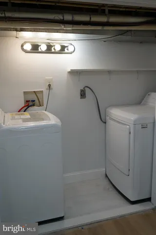 a bedroom with a bed and curtain