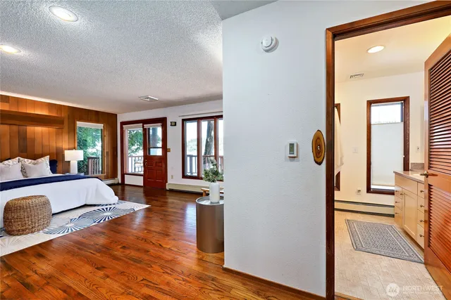 a bedroom with furniture and a window