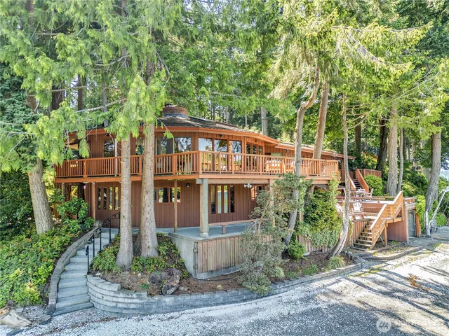 front view of a house with a tree