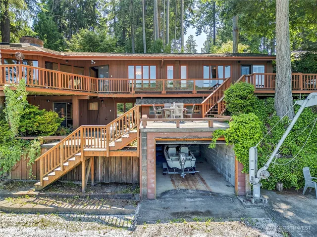 a view of a house with a yard and deck