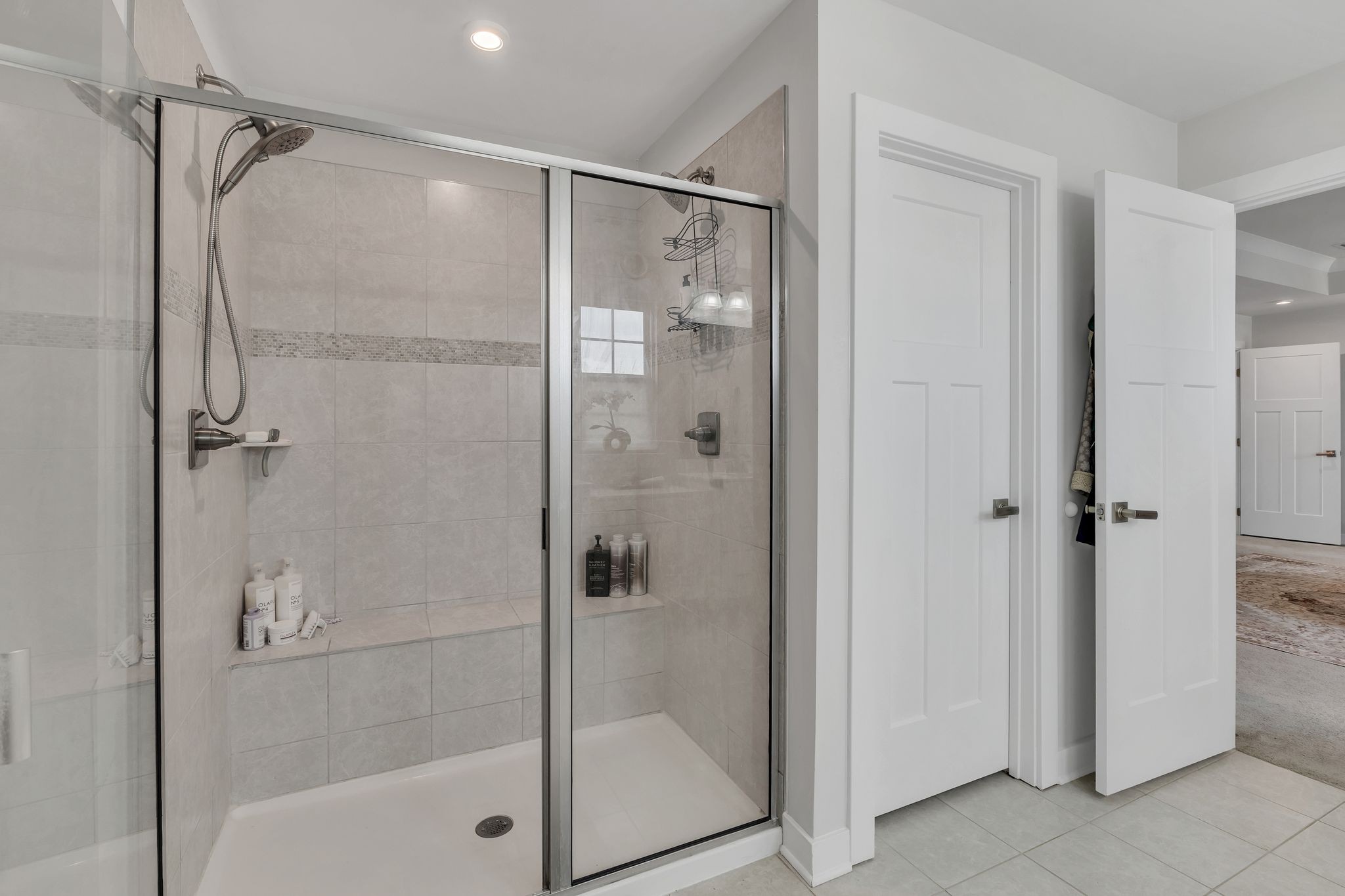 308 Finnegan Ct Spring Hill Spring Hill, TN 37174 - Photo 20 of 35 a bathroom with a glass shower door