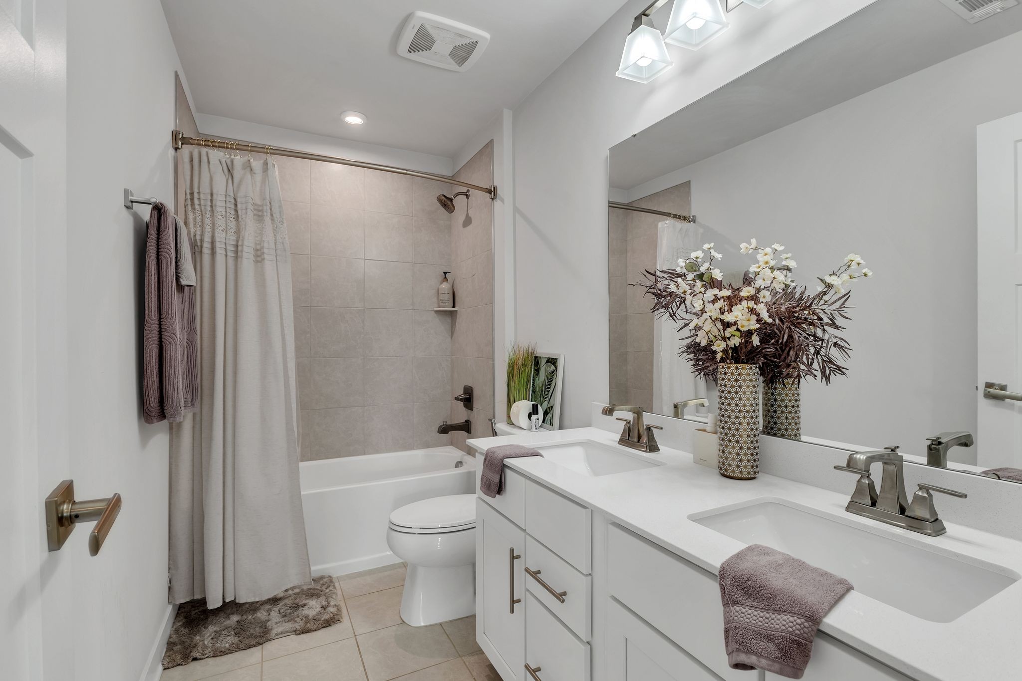 308 Finnegan Ct Spring Hill Spring Hill, TN 37174 - Photo 27 of 35 a bathroom with a double vanity sink toilet and shower