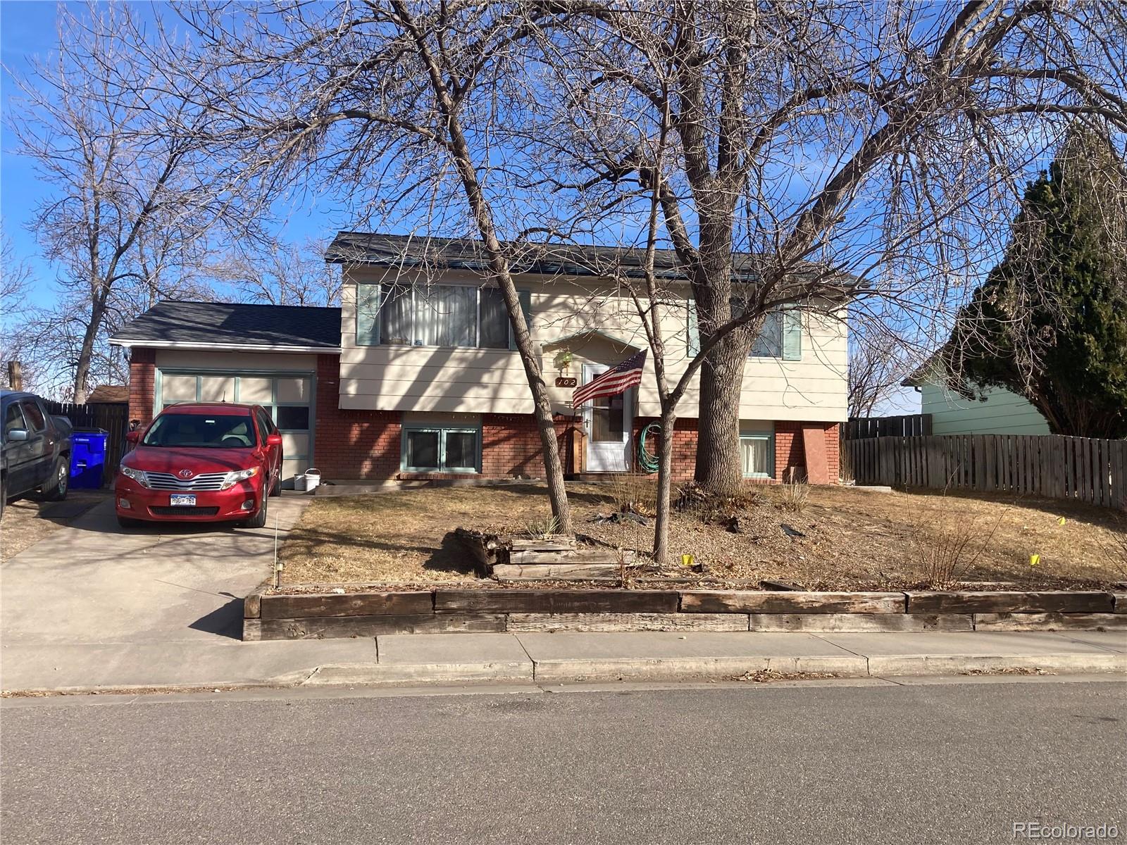 102 Third Street Berthoud, CO 80513 - Photo 1 of 35 a view of street with parked cars