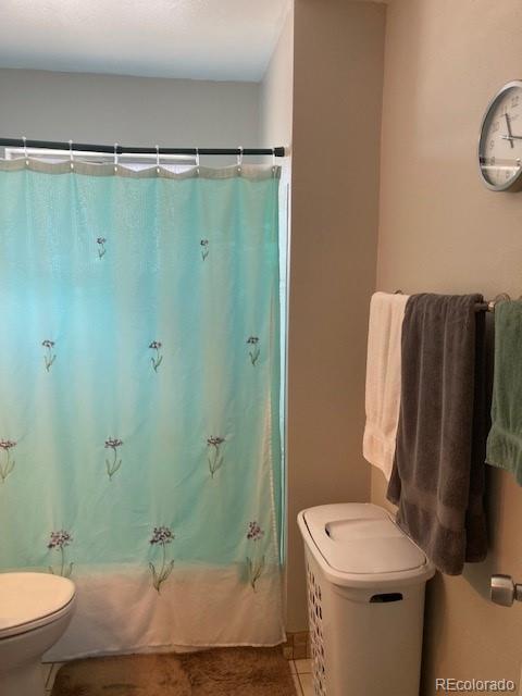 102 Third Street Berthoud, CO 80513 - Photo 17 of 35 a bathroom with a sink toilet and shower