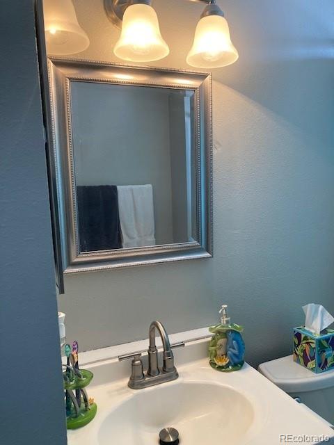 102 Third Street Berthoud, CO 80513 - Photo 18 of 35 a bathroom with a sink and a mirror
