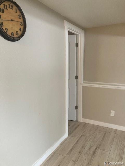 102 Third Street Berthoud, CO 80513 - Photo 20 of 35 an empty room with a refrigerator and a mirror