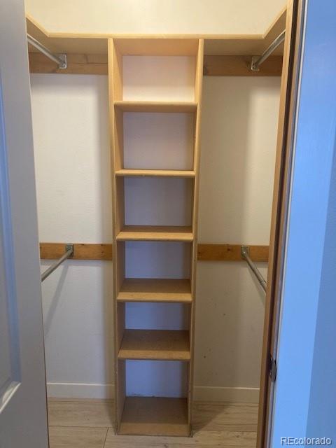102 Third Street Berthoud, CO 80513 - Photo 30 of 35 a view of walk in closet with empty racks