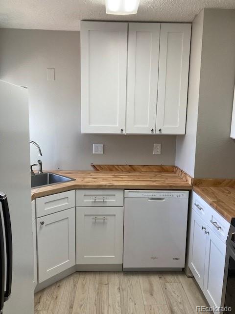 102 Third Street Berthoud, CO 80513 - Photo 7 of 35 a kitchen with granite countertop cabinets sink and stove