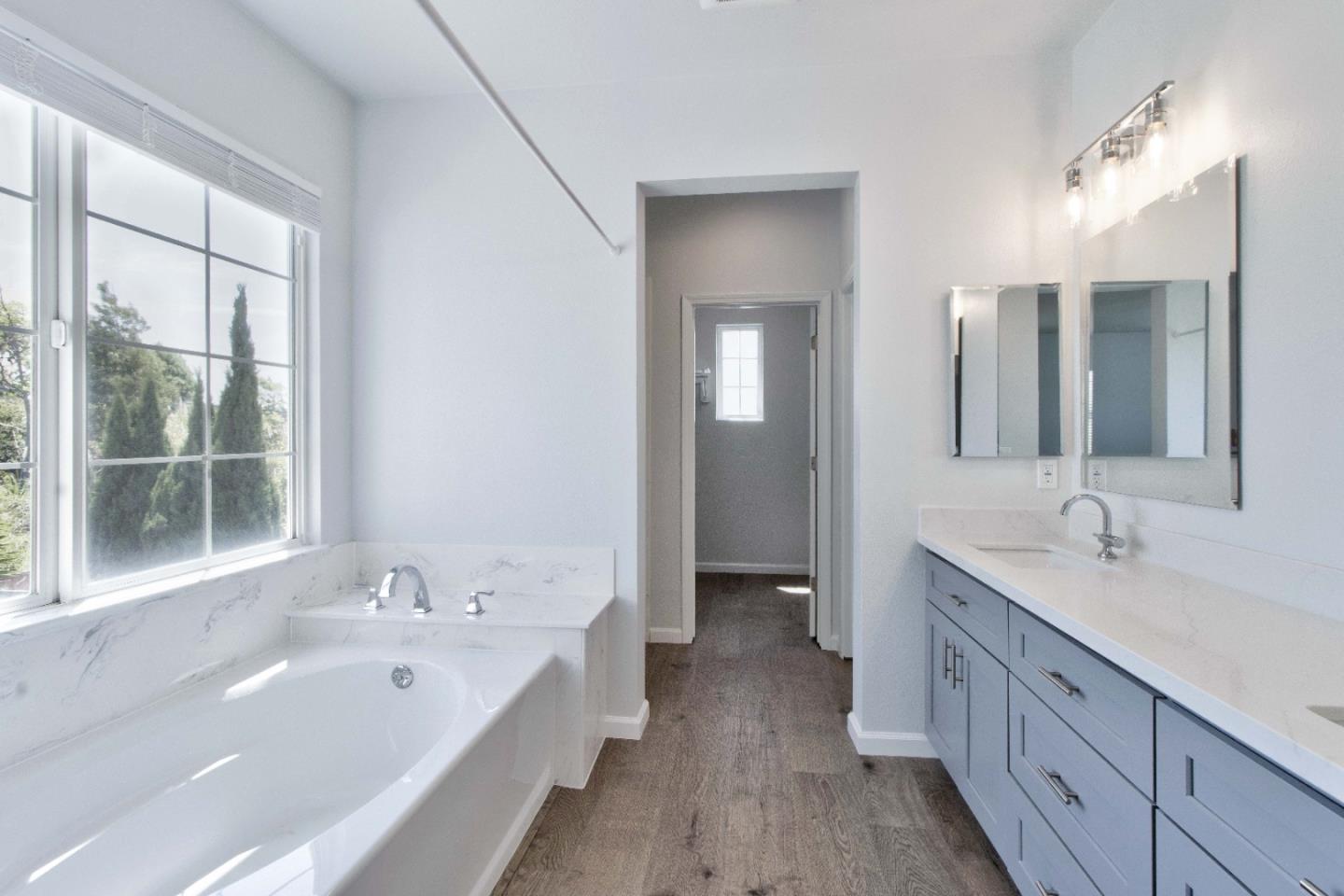 2715 Shellgate Circle Hayward, CA 94545 - Photo 25 of 47 a spacious bathroom with a double vanity sink a mirror and a bathtub