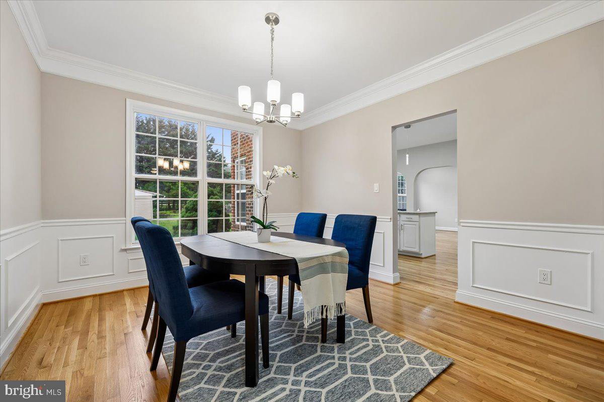 21712 Slidell Road Boyds, MD 20841 - Photo 4 of 32 a view of a dining room with furniture window and wooden floor