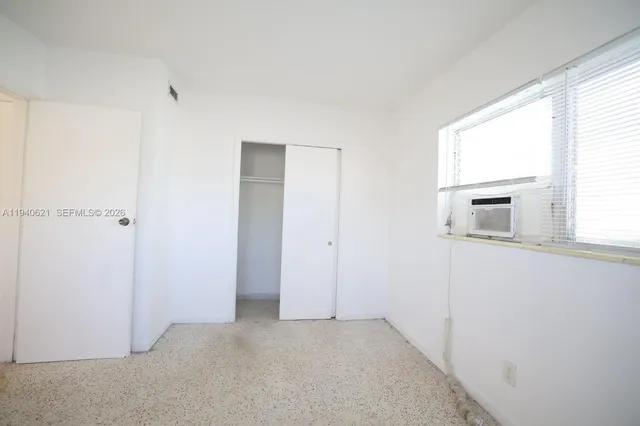 a view of a storage & utility room with a washer dryer