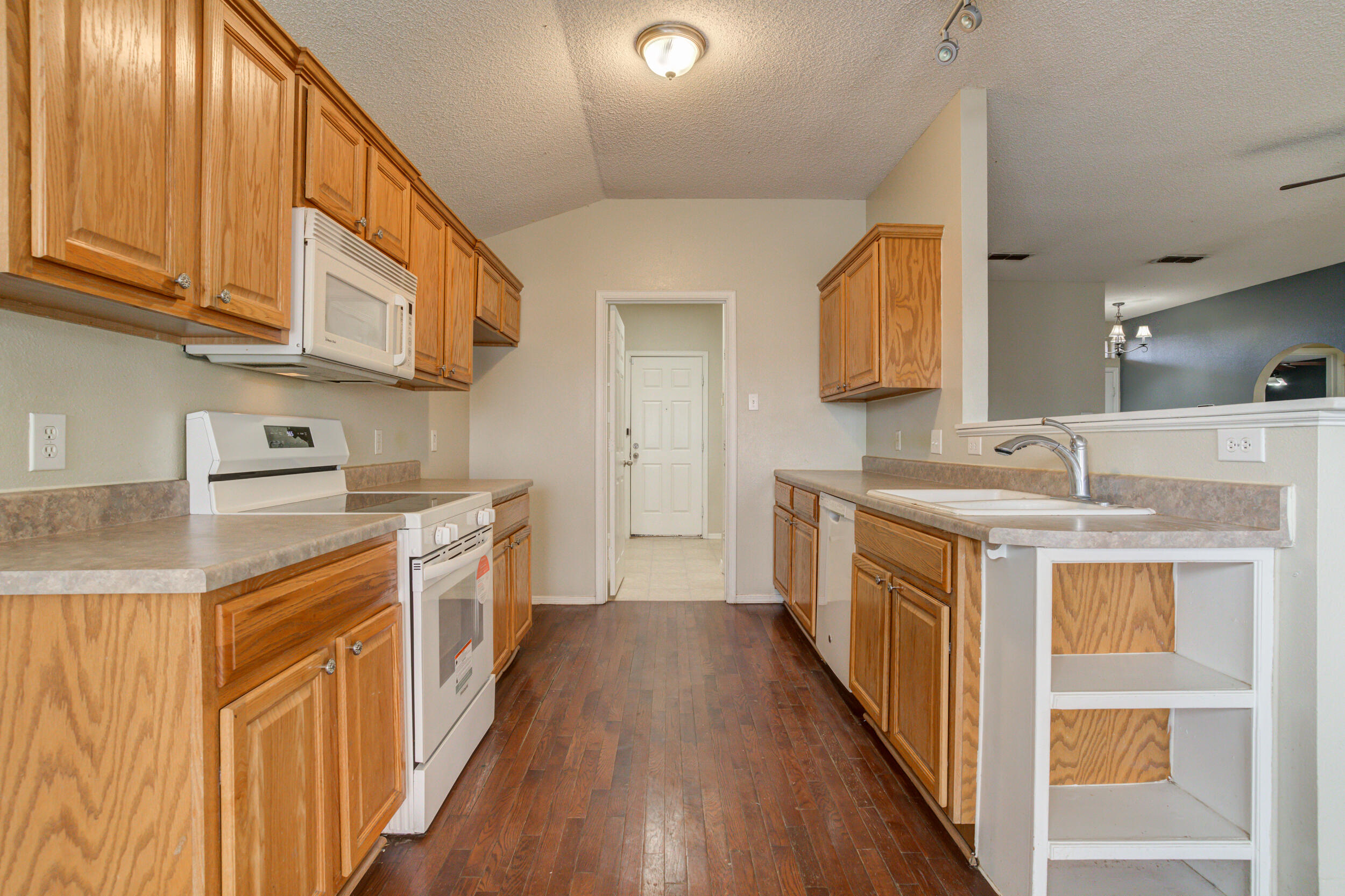 6221 18th Street Lubbock, TX 79416 - Photo 21 of 48 a kitchen with stainless steel appliances granite countertop a stove and a sink