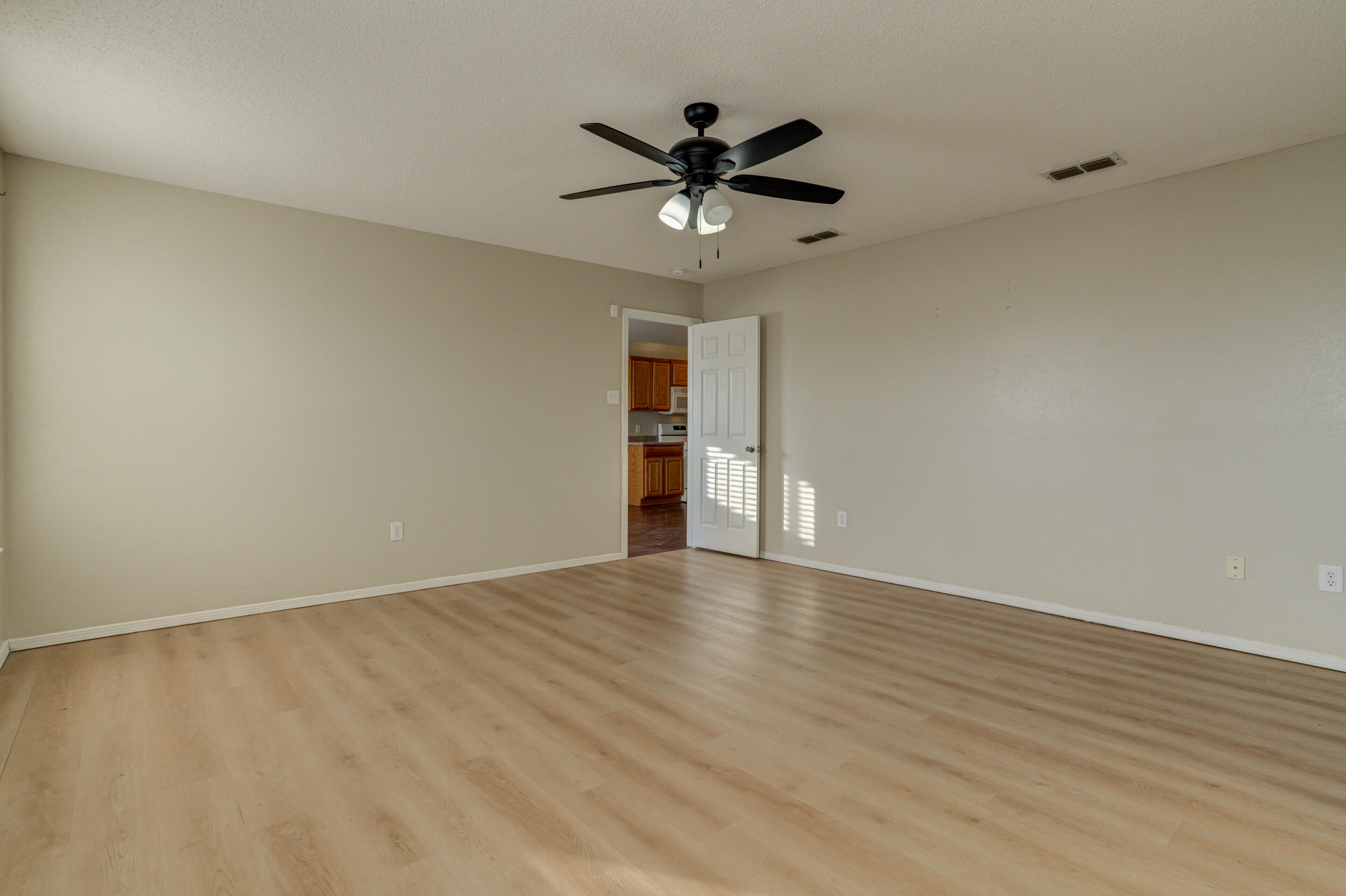 6221 18th Street Lubbock, TX 79416 - Photo 31 of 48 a view of an empty room with a window