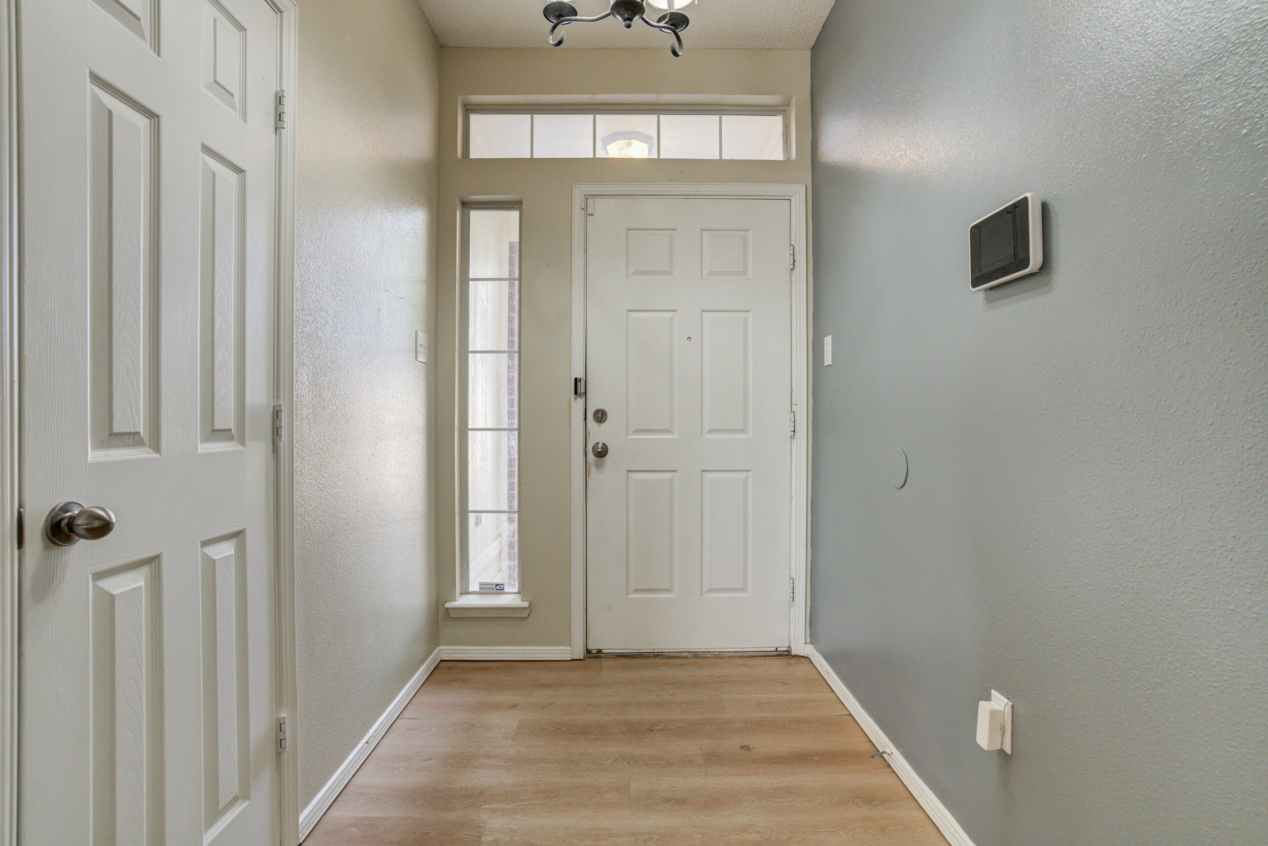 6221 18th Street Lubbock, TX 79416 - Photo 4 of 48 a view of a hallway with front door