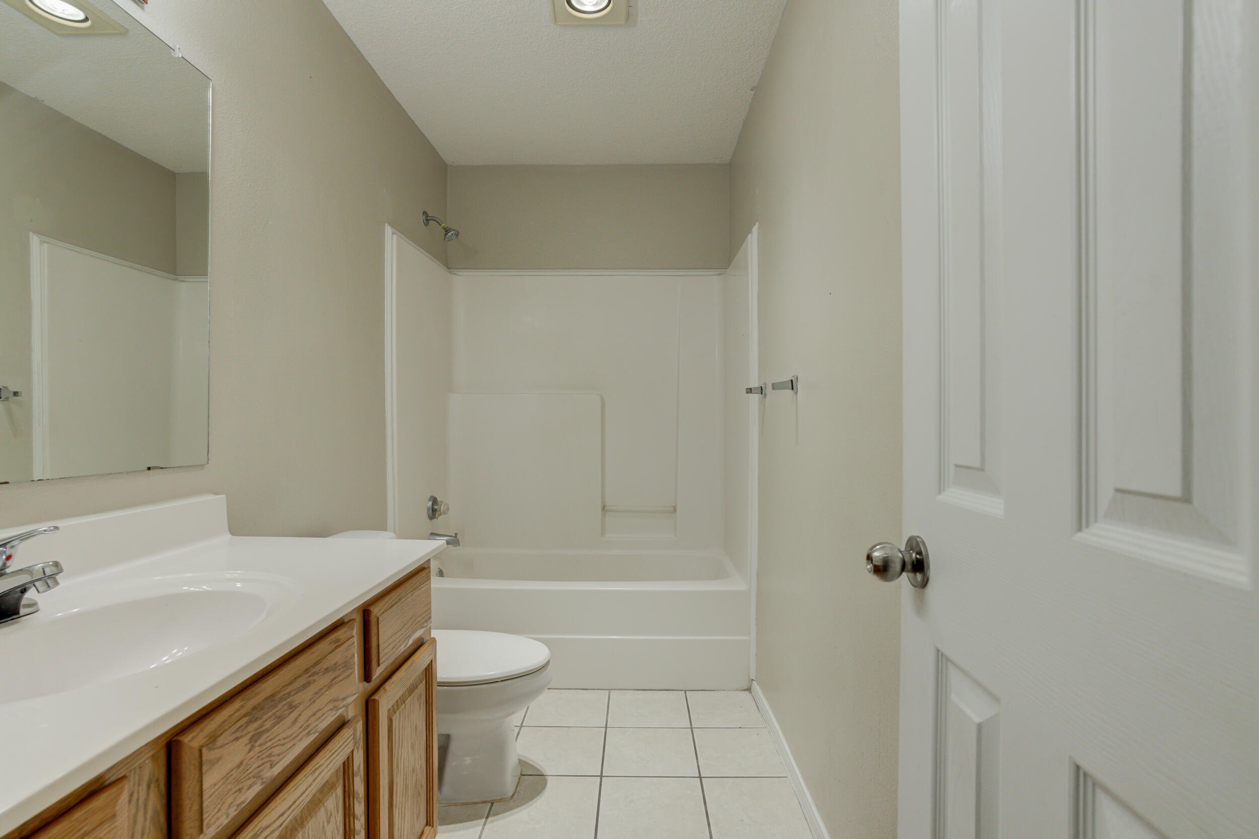 6221 18th Street Lubbock, TX 79416 - Photo 41 of 48 a bathroom with a sink a toilet and shower