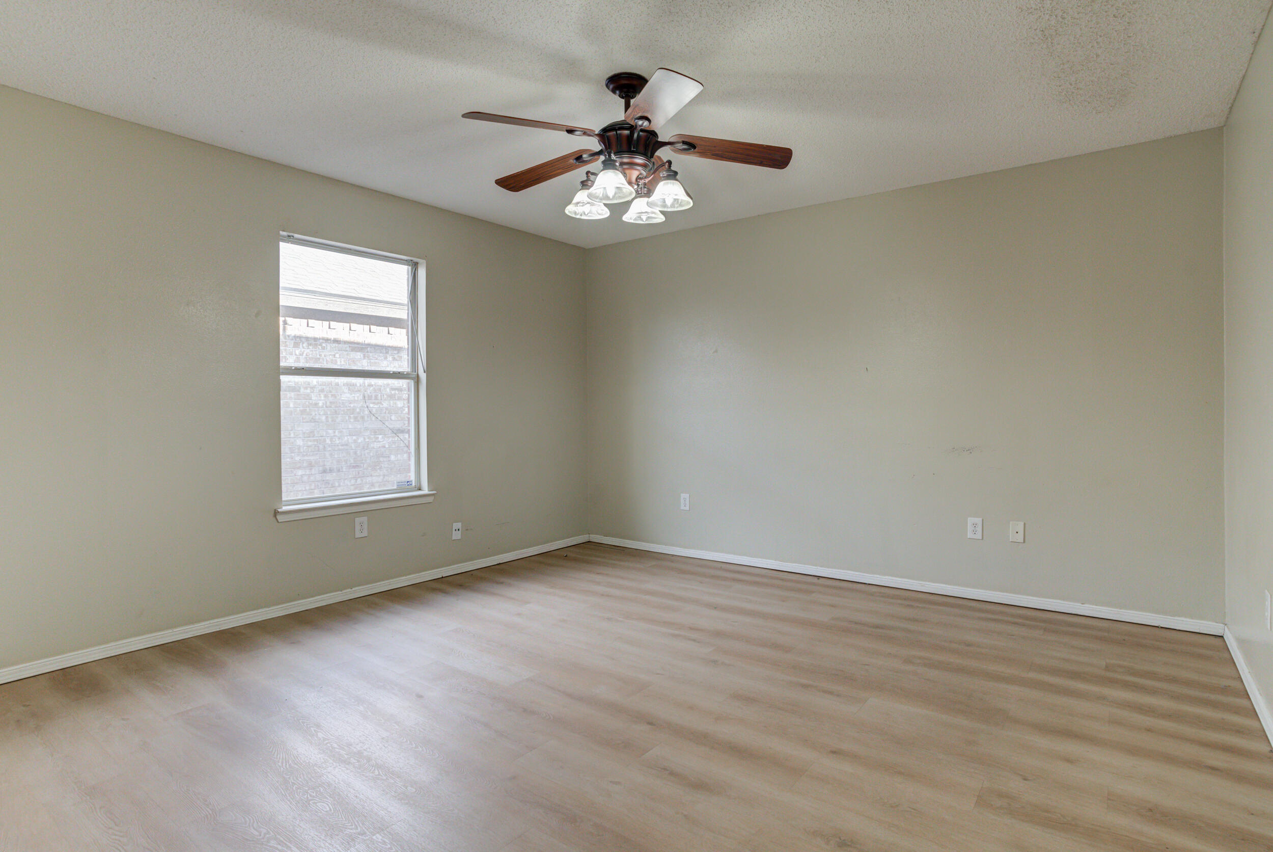 6221 18th Street Lubbock, TX 79416 - Photo 43 of 48 a view of an empty room with a window
