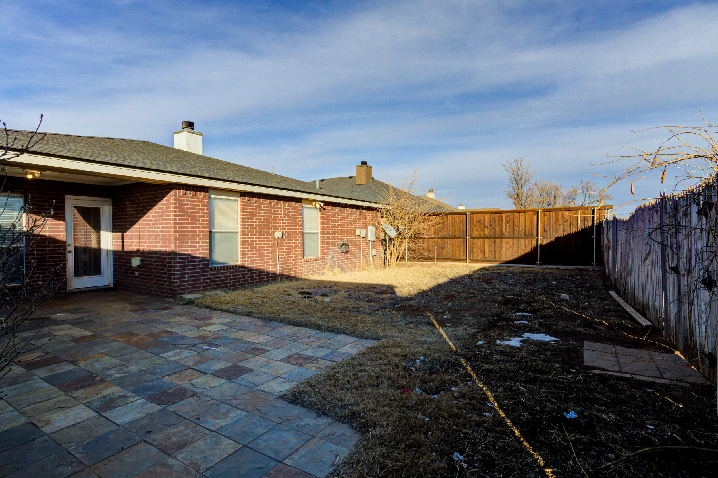 6221 18th Street Lubbock, TX 79416 - Photo 47 of 48 a view of a house with a wooden fence