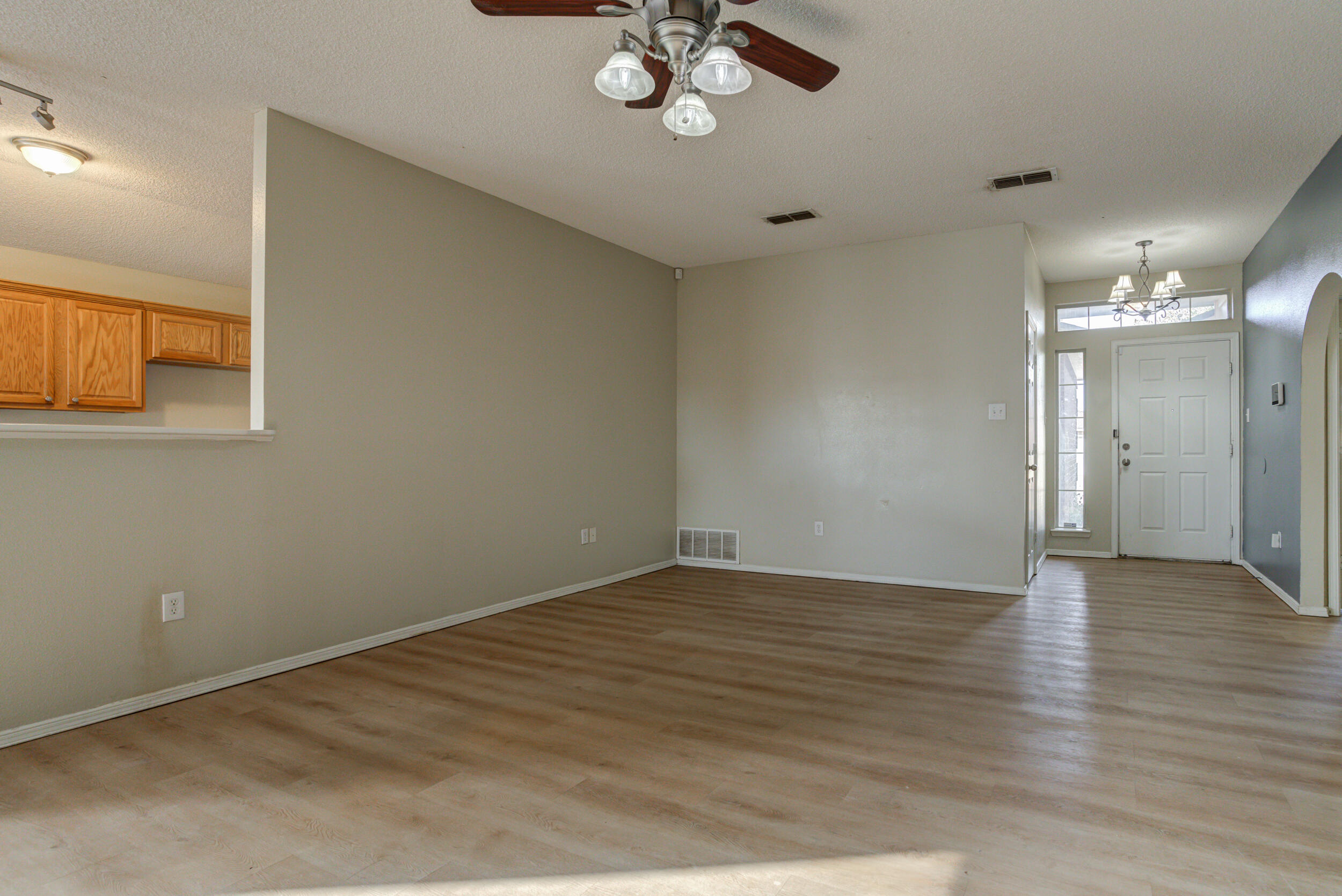 6221 18th Street Lubbock, TX 79416 - Photo 7 of 48 a view of an empty room with a window