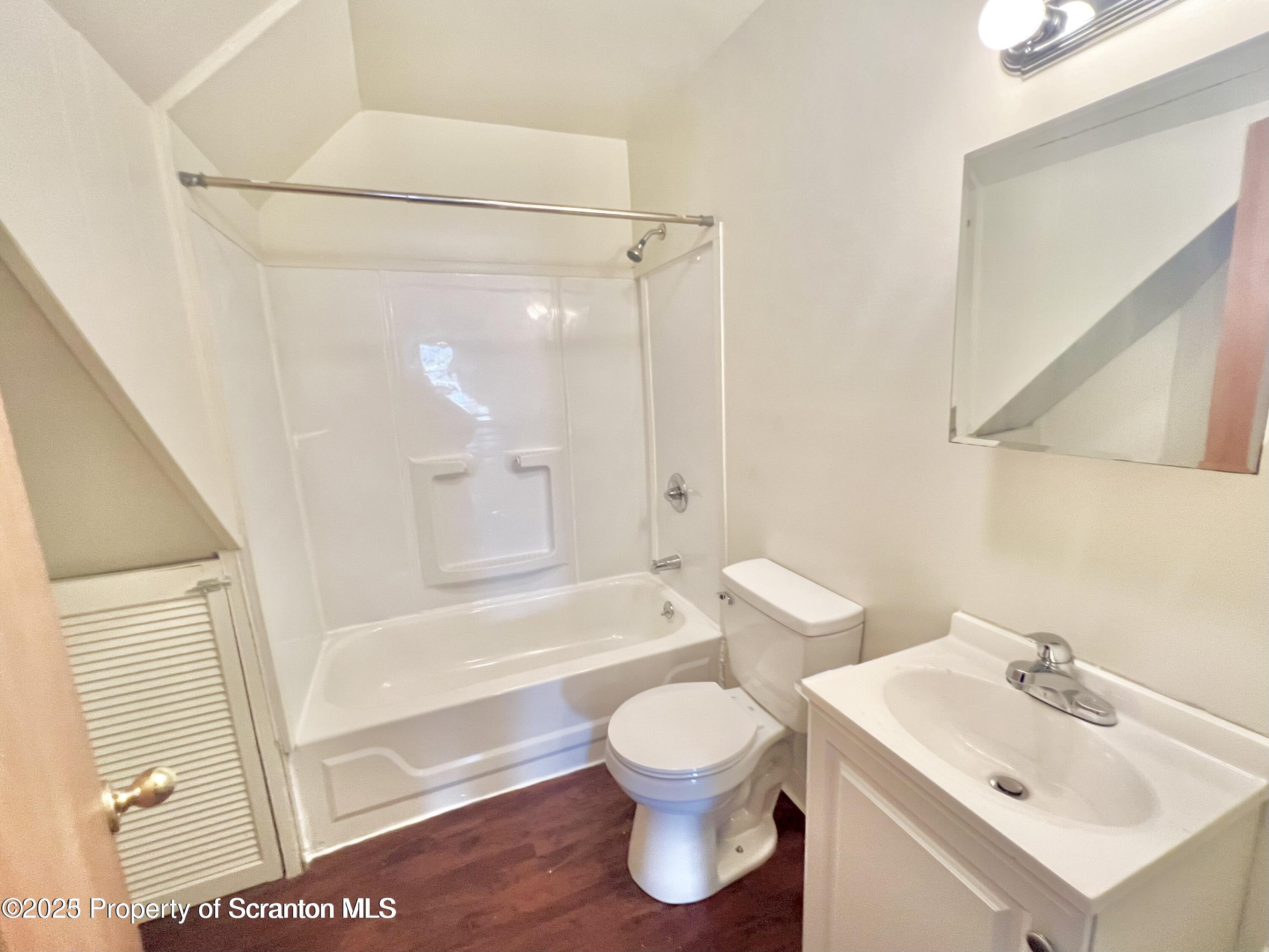 1930 Boulevard Avenue, Unit 3 Scranton, PA 18509 - Photo 2 of 8 a bathroom with a toilet sink and a bathtub