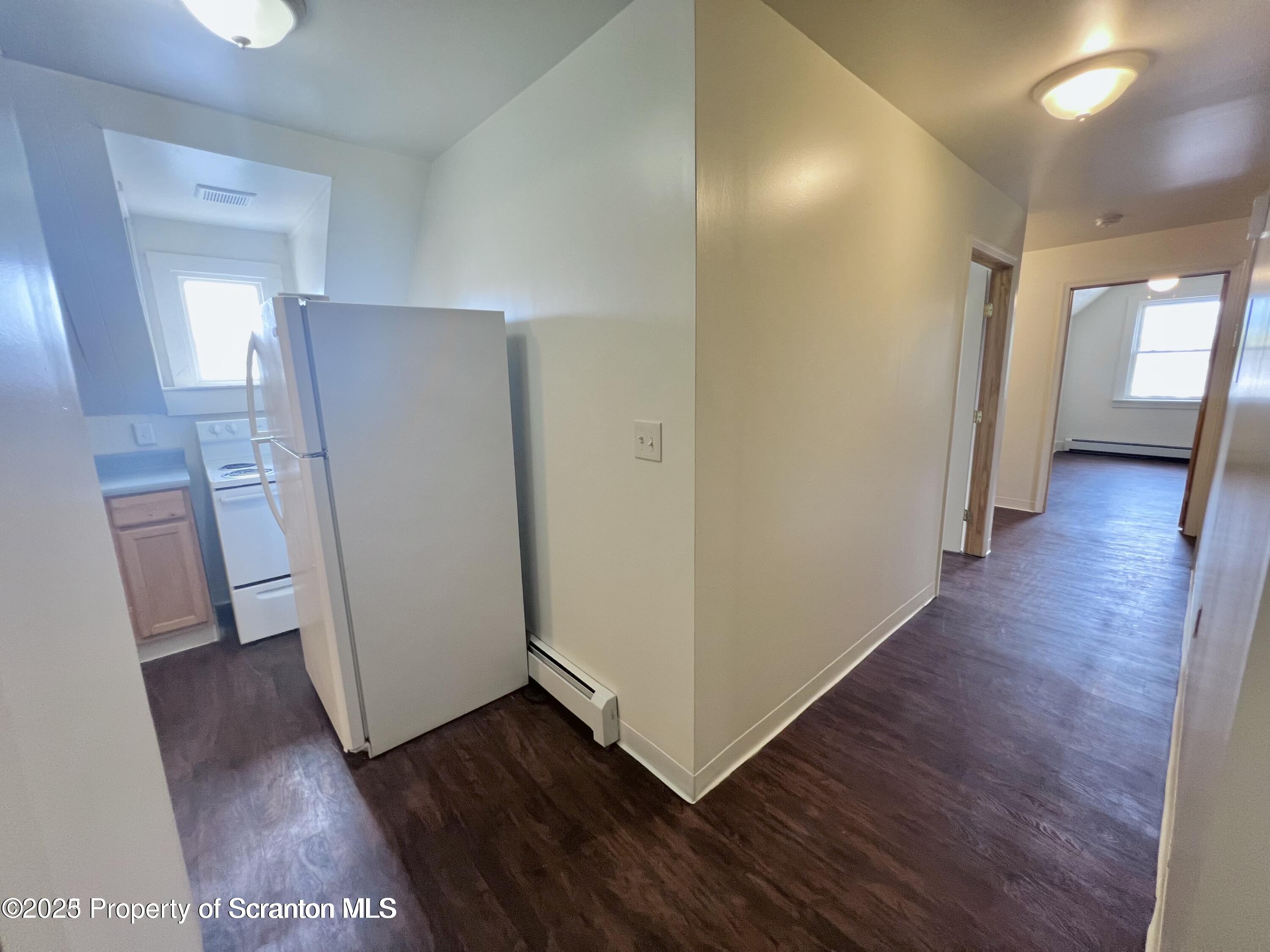 1930 Boulevard Avenue, Unit 3 Scranton, PA 18509 - Photo 4 of 8 a view of a hallway with wooden floor