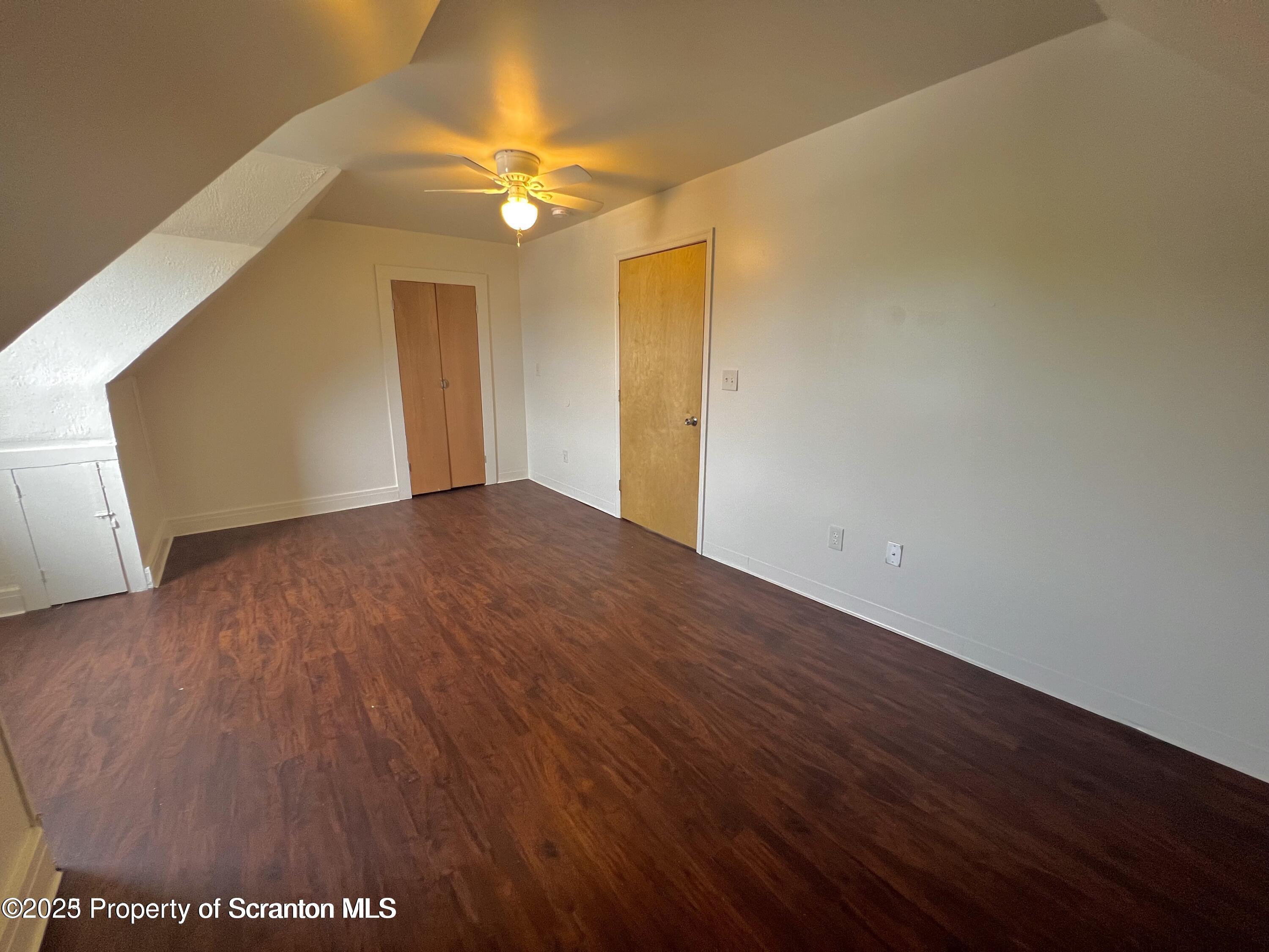 1930 Boulevard Avenue, Unit 3 Scranton, PA 18509 - Photo 7 of 8 a view of an empty room with wooden floor