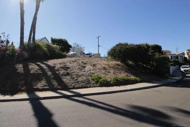 a view of a street with a building in the background