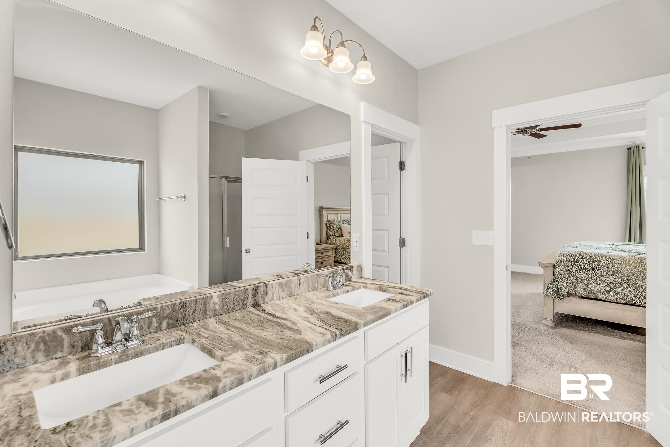 1720 Partridge Street Foley, AL 36535 - Photo 18 of 32 Bathroom featuring ceiling fan, dual bowl vanity, a bathtub, and hardwood / wood-style flooring