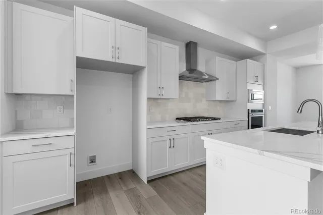 a kitchen with a stove and a microwave