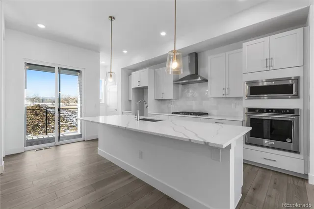 a view of a living room and chandelier