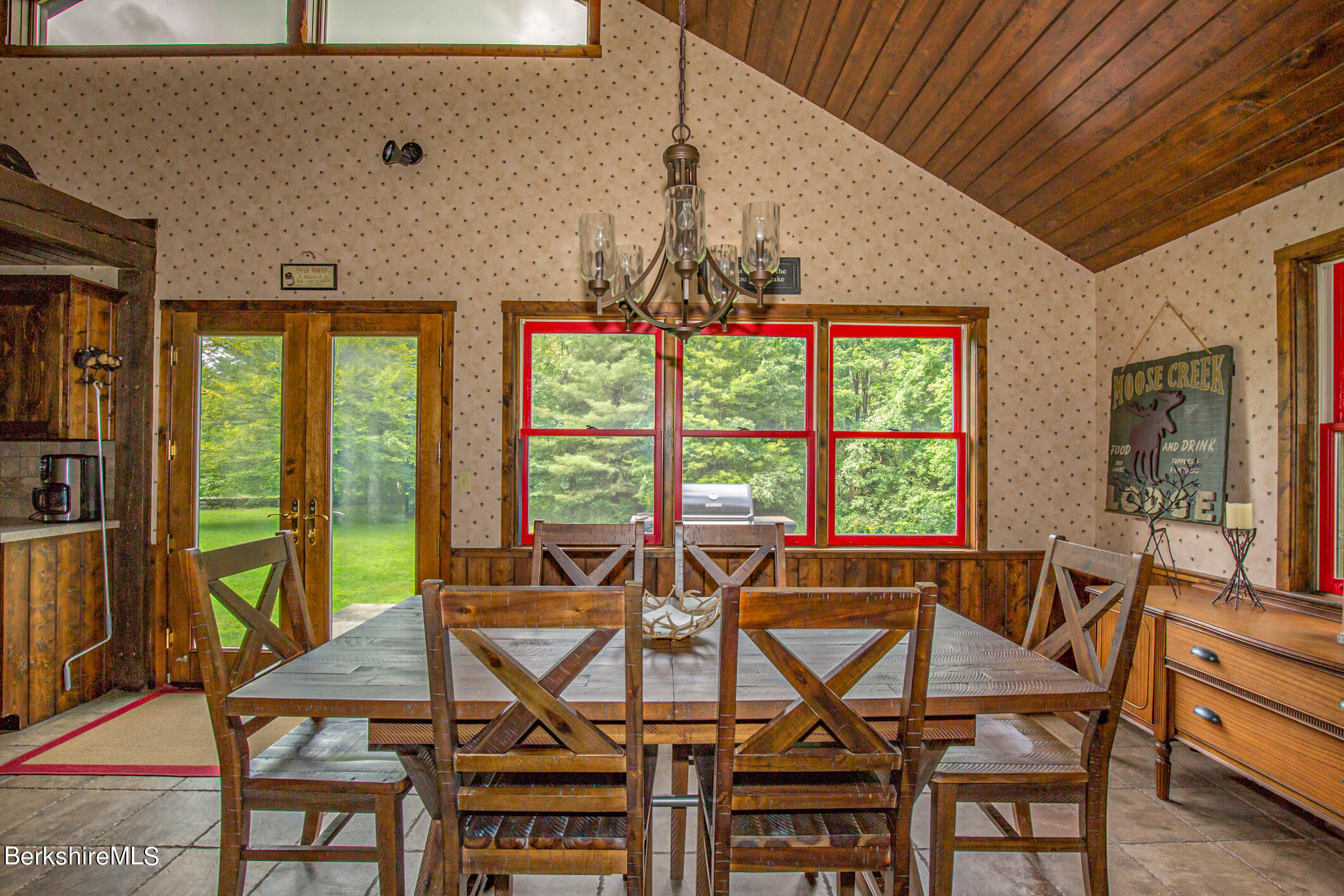 43 Becket Road Otis, MA 01029 - Photo 11 of 41 a view of a dining room with furniture large windows and wooden floor