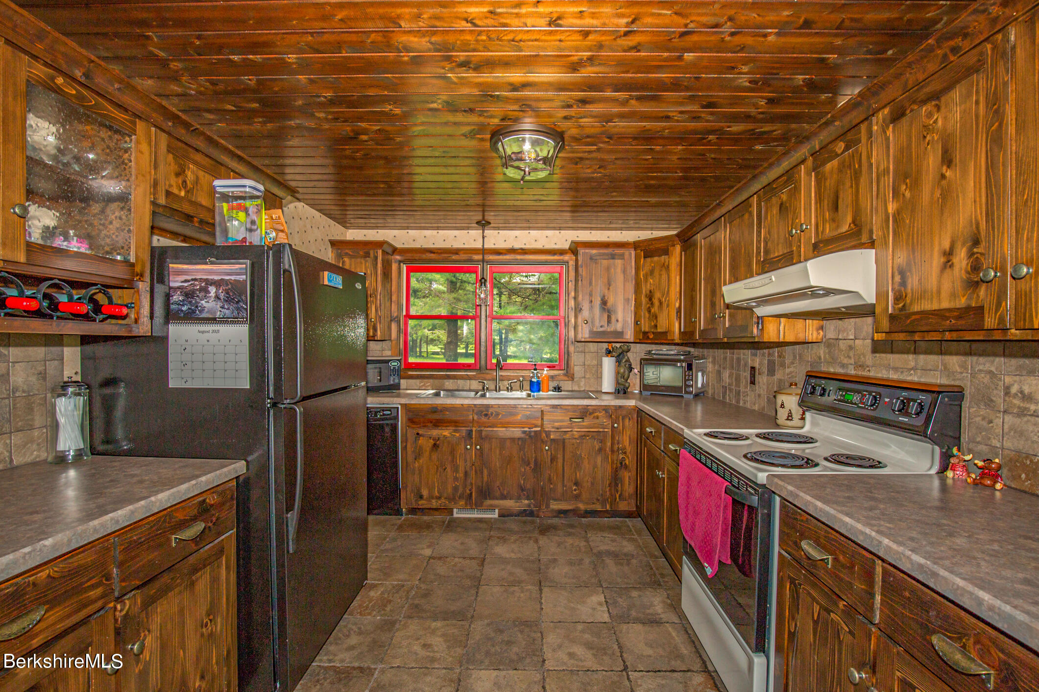 43 Becket Road Otis, MA 01029 - Photo 12 of 41 a kitchen with refrigerator and countertop