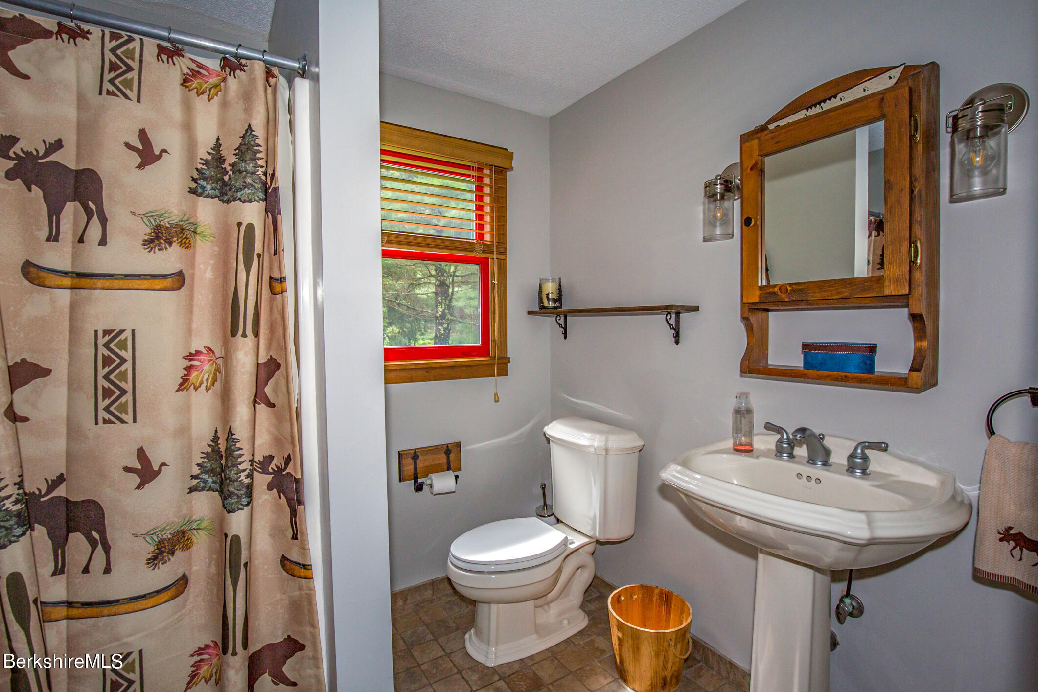 43 Becket Road Otis, MA 01029 - Photo 19 of 41 a bathroom with a toilet sink and mirror