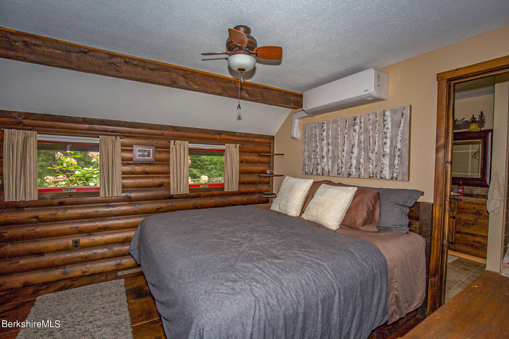 43 Becket Road Otis, MA 01029 - Photo 20 of 41 a bedroom with a large bed and a window