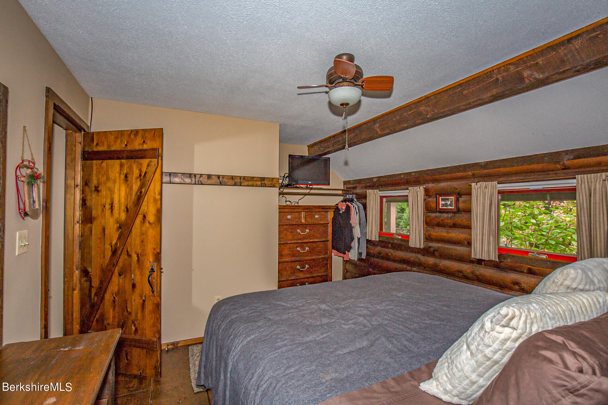 43 Becket Road Otis, MA 01029 - Photo 21 of 41 a bedroom with a bed and a dresser